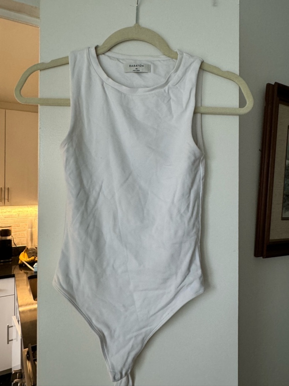 Babaton White Sleeveless Ribbed One-Piece Bodysuit